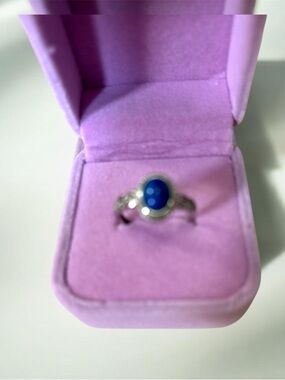 Natural blue Lapis Lazuli gemstone set in silver setting.